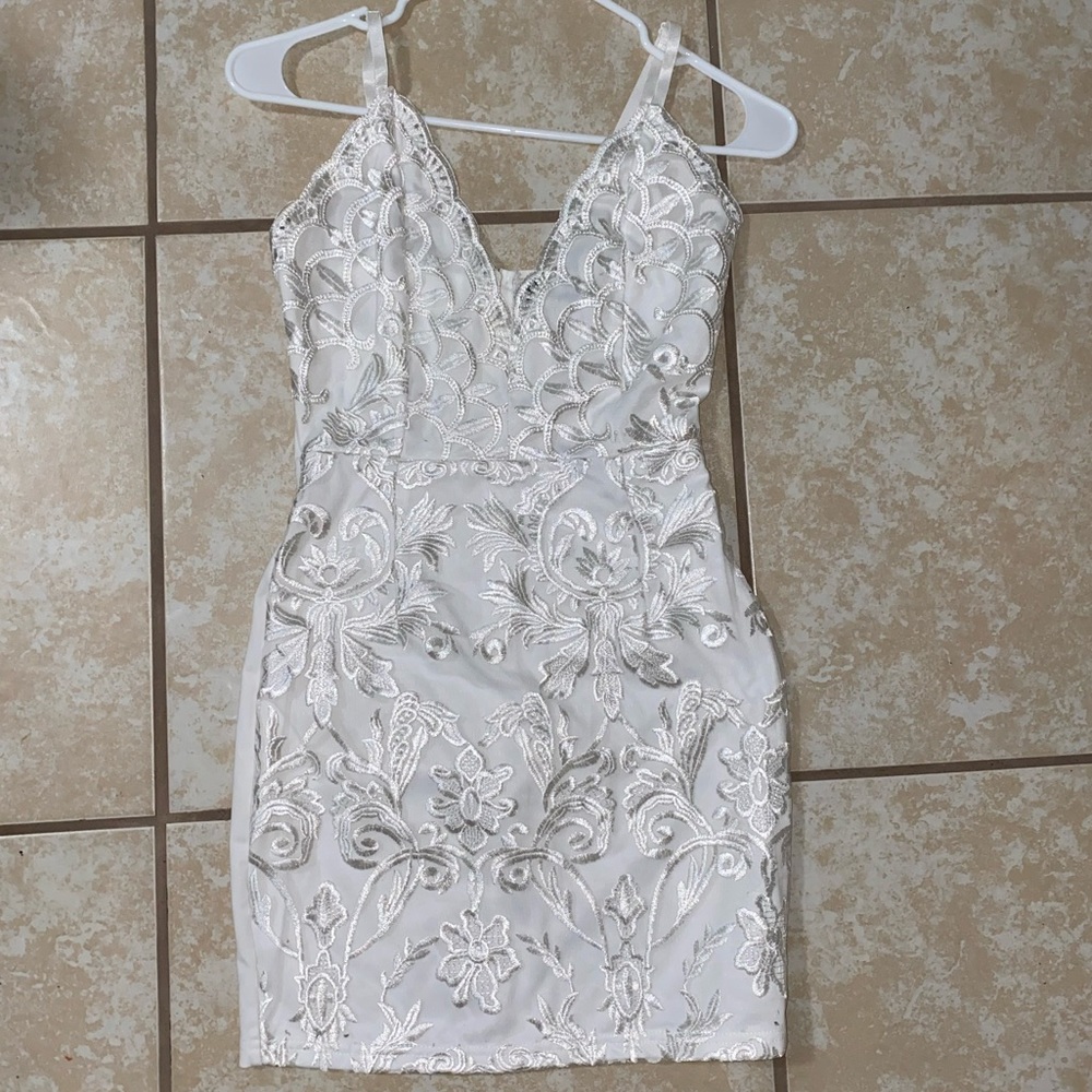 Pretty little thing, white lacy dress